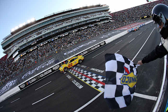 Joey Logano, driver of the #22 Shell Pennzoil Ford, takes the checkered flag to win the NASCAR Cup Series Busch Light Clash at the Los Angeles Memorial Coliseum. (Photo by Sean Gardner/Getty Images)